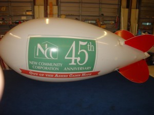 14ft.advertising-blimp-white-New-Community-Corp-logo 14 feet long white color polyurethane blimp with business logo for advertising purposes